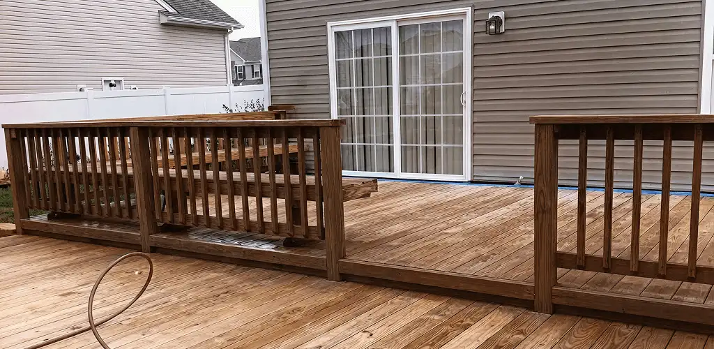 Deck sealing service protecting a backyard wood deck and railings in Orange, CA