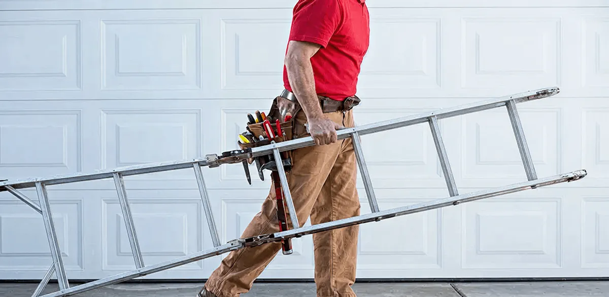 Garage door repair technician arriving with tools and ladder in Orange, CA
