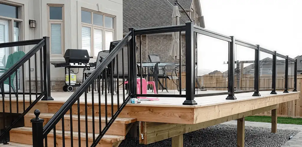 Handrail installation on a deck staircase for safety and code compliance in Orange, CA