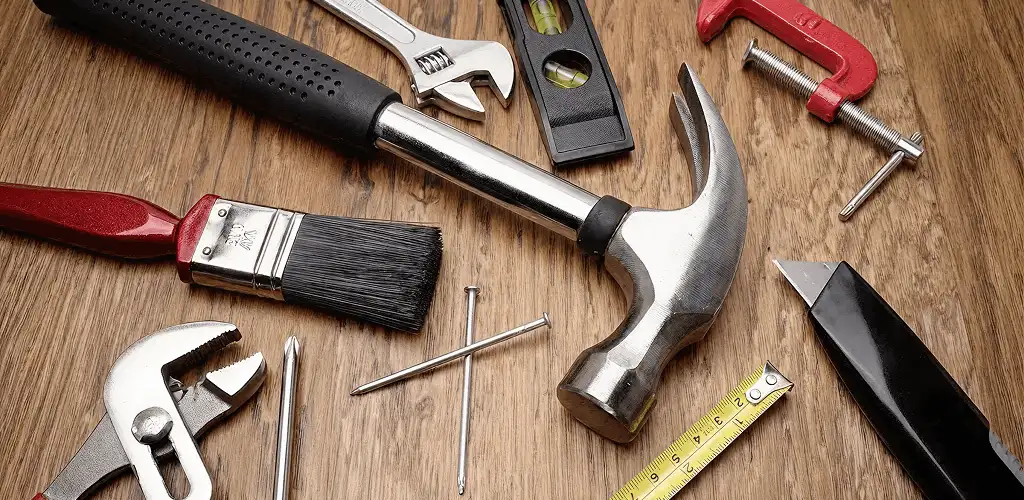 Handyman tools laid out for home repair and maintenance work in Orange, CA