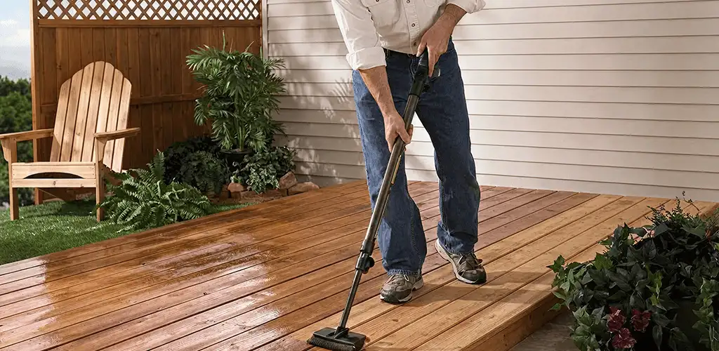 Deck staining service applying stain to a backyard wood deck in Orange, CA